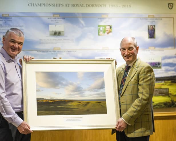 Paul Lawrie receives a framed print of the Championship Course from general manager Neil Hampton to mark being made an honorary member of Royal Dornoch. Picture: Picture: Matthew Harris