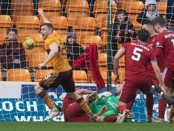 Connor Shields turns away to celebrate after making it 2-1 to Motherwell against Aberdeen at Fir Park. (Photo by Craig Foy / SNS Group)