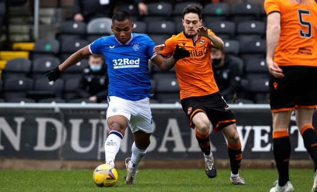 Alfredo Morelos challenges Dundee United's Liam Smith during Rangers' 2-1 win at Tannadice.
