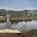 A worker walks across the Union Chain Bridge which is set to officially reopen next week. Picture: Phil Wilkinson