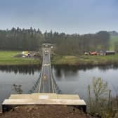 A worker walks across the Union Chain Bridge which is set to officially reopen next week. Picture: Phil Wilkinson