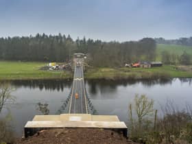 A worker walks across the Union Chain Bridge which is set to officially reopen next week. Picture: Phil Wilkinson