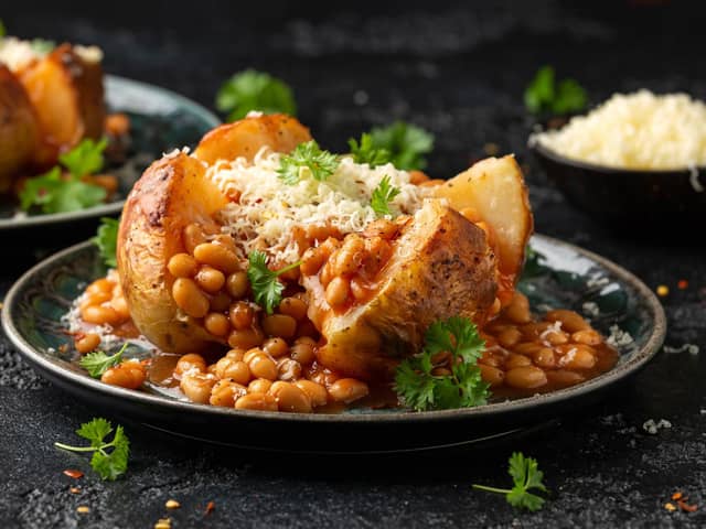 Jacket Baked potato with tomato beans, cheddar cheese. Pic: Adobe