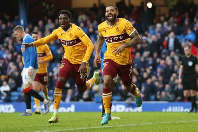 Kaiyne Woolery (right) celebrates after scoring Motherwell's equaliser in the 2-2 draw against Rangers at Ibrox on Sunday. (Photo by Craig Williamson / SNS Group)