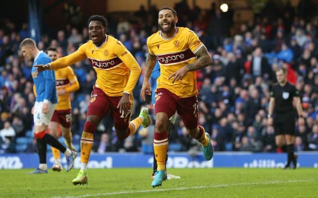 Kaiyne Woolery (right) celebrates after scoring Motherwell's equaliser in the 2-2 draw against Rangers at Ibrox on Sunday. (Photo by Craig Williamson / SNS Group)