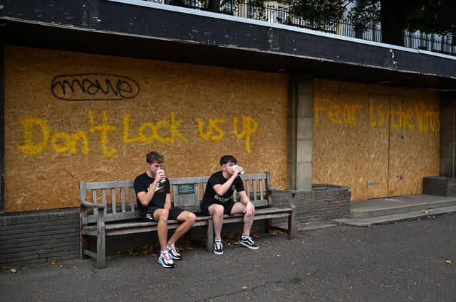 Members of the public are seen on Princess Street. First Minister Nicola Sturgeon has confirmed the Scottish Government is planning to introduce a new five-tier coronavirus lockdown system from November 2. Picture: Jeff J Mitchell/Getty Images