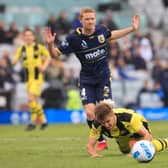 Kye Francis Rowles of the Mariners brings down Benjamin Old of Phoenix in the penalty area during the A-League match between Wellington Phoenix and Central Coast Mariners at WIN Stadium, on November 27, 2021, in Wollongong, Australia. (Photo by Mark Evans/Getty Images)