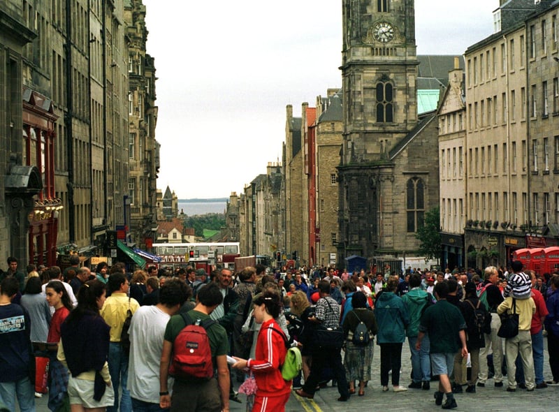 Crowds in the High Street watching street performers during the 1996 Edinburgh Festival.