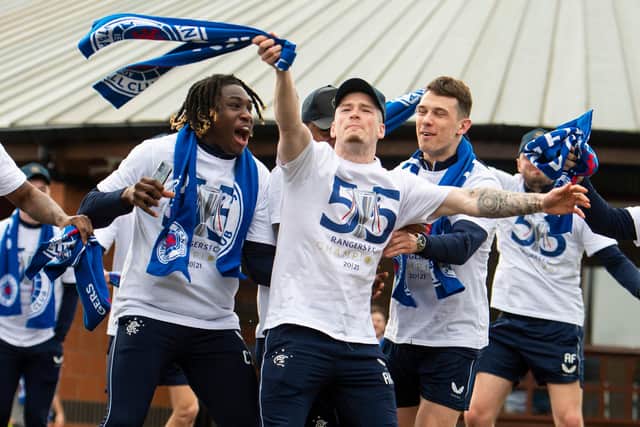 Rangers players celebrate after winning the Scottish Premiership title last year. Picture: SNS