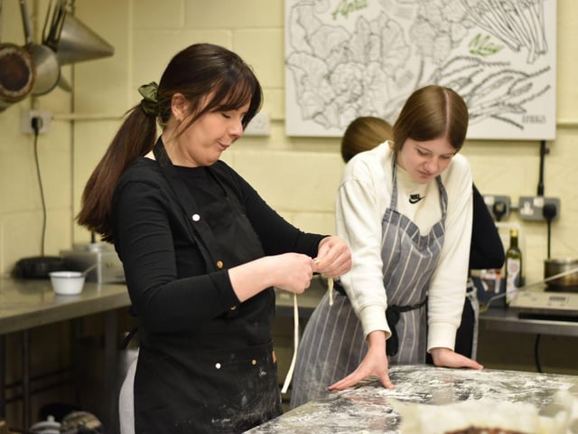 Lauren Munro and one of the participants making hand-pulled noodles.