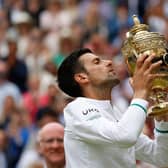 Novak Djokovic celebrates his sixth Wimbledon title