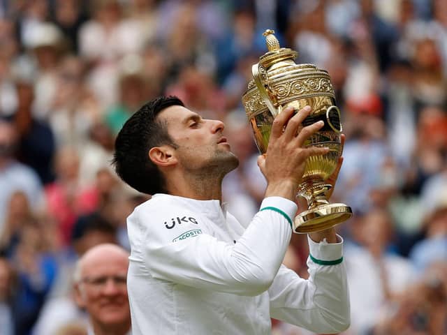 Novak Djokovic celebrates his sixth Wimbledon title