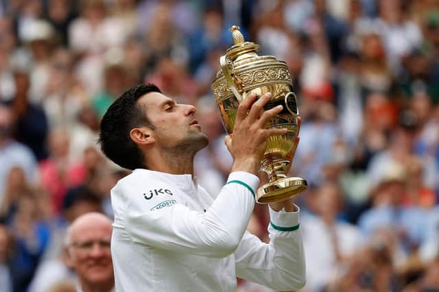 Novak Djokovic celebrates his sixth Wimbledon title