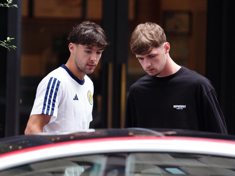 Scotland's Aaron Hickey and Tyler Fletcher leaving the team hotel