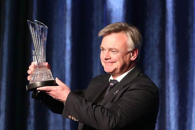 Ken Shofield holds up his award during his induction into the World Golf Hall of Fame at the World Golf Village in St Augustine, Florida in 2013. Picture: Marc Serota/Getty Images.