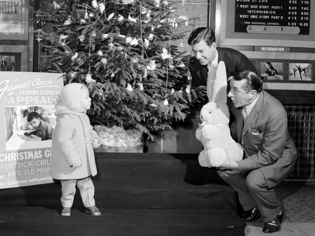 Lex McLean hands in a huge rabbit to Edinburgh's New Victoria Cinema as part of a charity present appeal in November 1962.