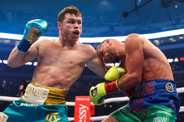 Mexico's Saul "Canelo" Alvarez, left, connects with Billy Joe Saunders during their super middleweight title fight at the AT&T Stadium in Arlington, Texas. Picture: Ed Mulholland/Matchroom Boxing/AFP via Getty Images