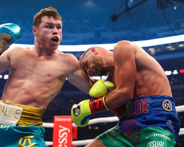 Mexico's Saul "Canelo" Alvarez, left, connects with Billy Joe Saunders during their super middleweight title fight at the AT&T Stadium in Arlington, Texas. Picture: Ed Mulholland/Matchroom Boxing/AFP via Getty Images