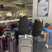 Edinburgh Airport's baggage reclaim hall has been cluttered this week with luggage that arrived long after passengers had left (Picture: Contributed)
