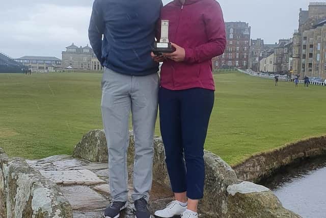 Jen Saxton and caddie Colin Edgar celebrate their success in the St Rule Trophy.