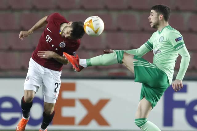 Ryan Christie battles for possession with Sparta's Michal Travnik. Picture: AP