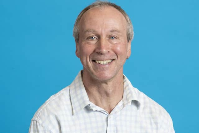 Mark Huxham staff portraits Sighthill. Blue Background Oct 2022