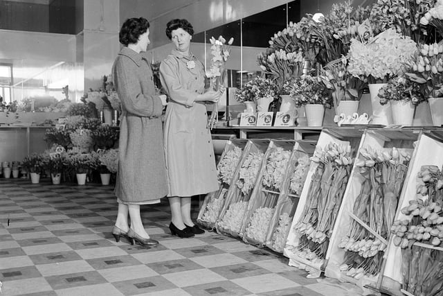 In March 1960 a new shop opened at 80 Princes Street - Rankins' Flowers and Fruit. Two staff members are pictured with an impressive display of flowers.
