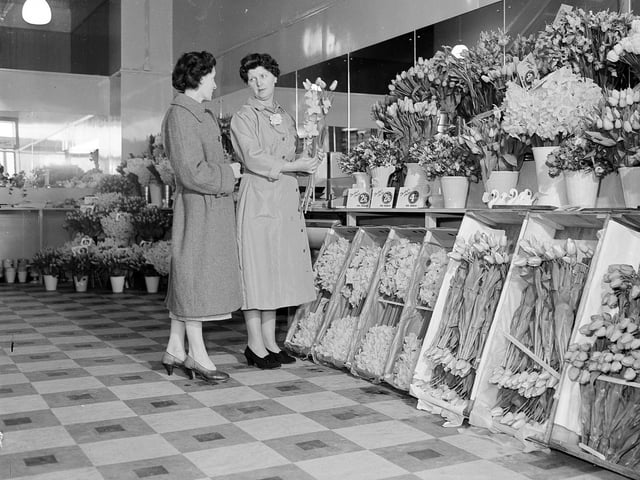 In March 1960 a new shop opened at 80 Princes Street - Rankins' Flowers and Fruit. Two staff members are pictured with an impressive display of flowers.