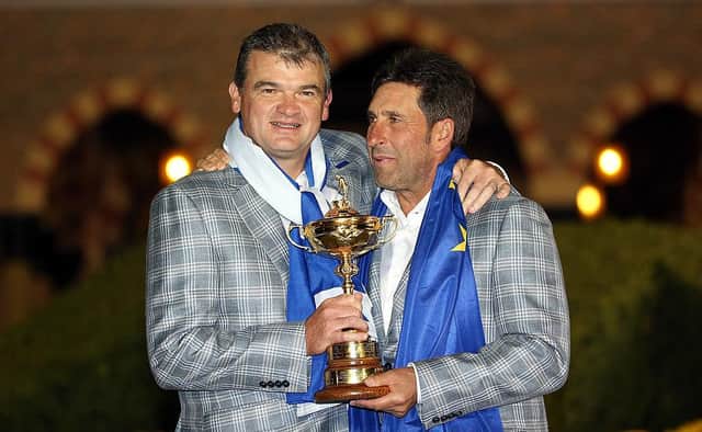 Paul Lawrie celebrates with captain Jose Maria Olazabal after Europe's dramatic win in the 2012 Ryder Cup at Medinah Country Club. Picture: Ross Kinnaird/Getty Images.