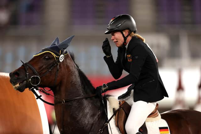 Annika Schleu of Germany looks upset as she battles to control Saint Boy during the modern pentathlon at the Tokyo Olympics. (Photo by Dan Mullan/Getty Images)