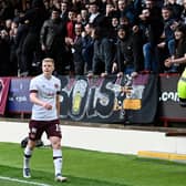 Hearts' Alex Cochrane walks around the pitch after he mistakenly thought he was being substituted during his side's match against Motherwell. Photo by Rob Casey / SNS Group