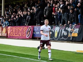 Hearts' Alex Cochrane walks around the pitch after he mistakenly thought he was being substituted during his side's match against Motherwell. Photo by Rob Casey / SNS Group