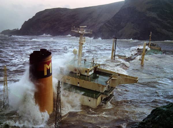 Oil gushes from the stricken Liberian-registered Braer tanker after it ran aground at Garths Ness on the Shetland Islands on January 5, 1992. (Photo by GERRY PENNY/AFP via Getty Images)