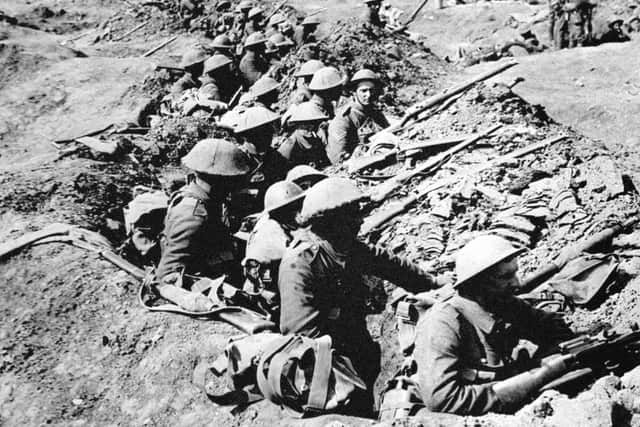 British infantrymen occupying a shallow trench before an advance during the Battle of the Somme