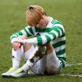 Celtic's Kyogo Furuhashi suffers an injury at McDiarmid Park.