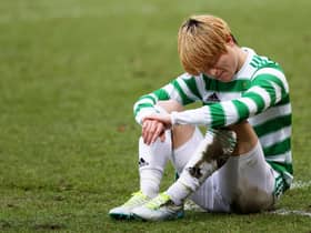Celtic's Kyogo Furuhashi suffers an injury at McDiarmid Park.