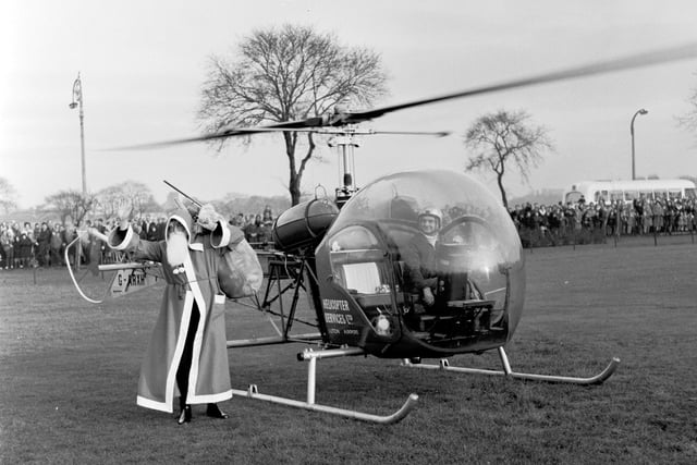 Santa Claus arrives at Leith Links, Edinburgh, by helicpoter in 1965.