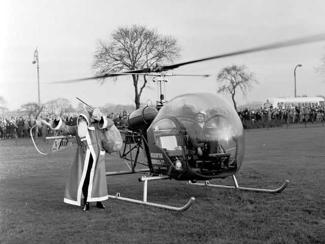 Santa Claus arrives at Leith Links, Edinburgh, by helicpoter in 1965.