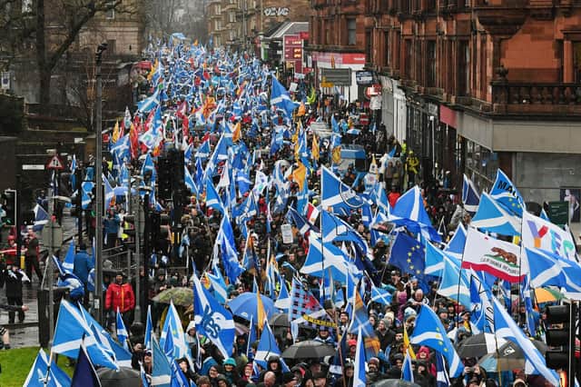 Independence supporters march through Glasgow, but is the focus on constitutional matters letting down children living in poverty? (Picture: John Devlin)