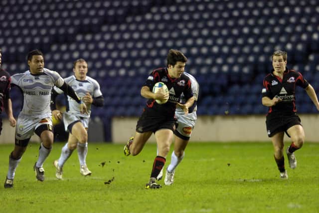 Hugo Southwell, with Phil Godman in support, on the attack for Edinburgh against Castres at Murrayfield in the 2008-09 season when they beat the French side home and away. Picture: Greg Macvean/The Scotsman