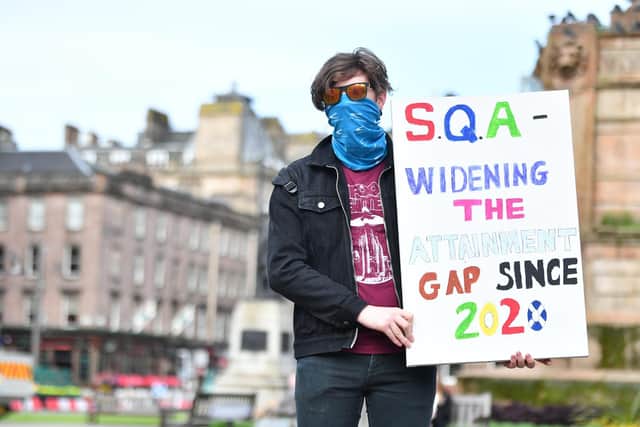 A school pupil standing in George Square, Glasgow, to demonstrate against the latest marking scheme used by SQA for exams photo:JPI Media/John Devlin