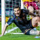 Dundee United's Tony Watt scored against his former club Motherwell in a 2-0 win.