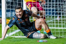 Dundee United's Tony Watt scored against his former club Motherwell in a 2-0 win.