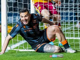 Dundee United's Tony Watt scored against his former club Motherwell in a 2-0 win.