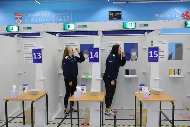 Students Fiona Waddell and Lily Wallace demonstrate the test at St Andrews University.