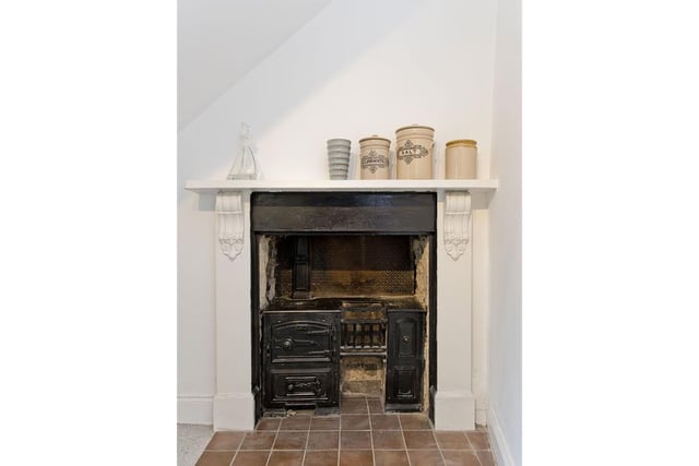 Feature fireplace in scullery.