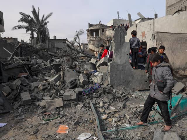 Palestinians inpect the damage in the rubble of a building where two hostages were reportedly held before being rescued during an operation by Israeli security forcess in Rafah, on the southern Gaza Strip. Picture: Said Khatib/AFP via Getty Images