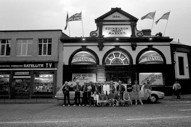 Staff dressed as gangsters beside a stretch limousine to advertise the opening of Fat Sam's Chicago-style diner and bar on the site of the Edinburgh meat market at Fountainbridge in September 1986.