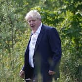 Boris Johnson walking through the grounds during the G7 summit in Schloss Elmau, in the Bavarian Alps, Germany.