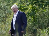 Boris Johnson walking through the grounds during the G7 summit in Schloss Elmau, in the Bavarian Alps, Germany.